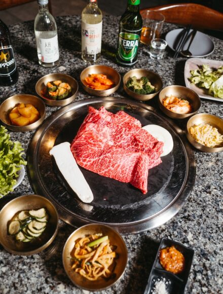 a table topped with bowls and plates of food